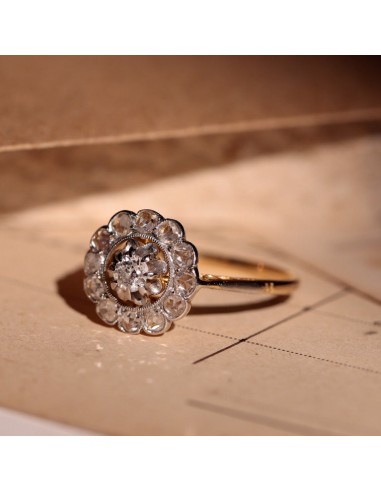 Bague marguerite ancienne deux ors et diamants Pour